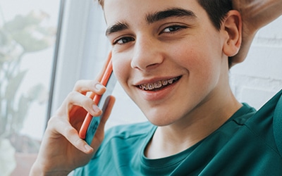 Male teenager with braces